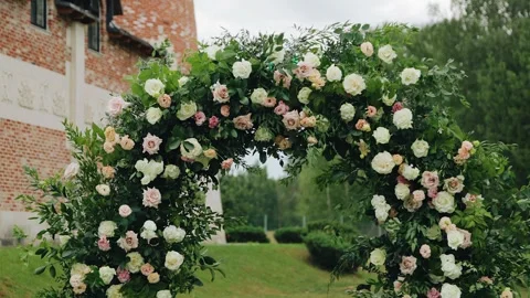 A beautiful wedding arch made of fresh flowers Stock Footage 294343986