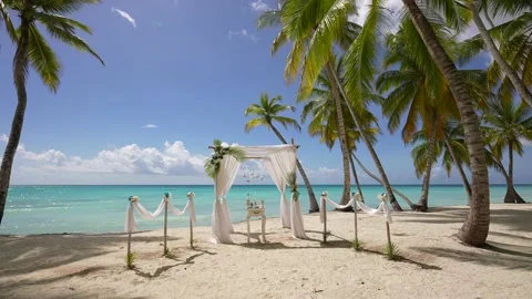 Beautiful wedding beach set up decorated with cloth and flowers outdoors.Wedding Stock Footage 166559242