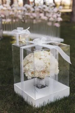 Beautiful wedding bouquet in box. white flowers outdoors Stock Photos