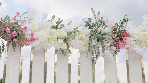 Beautiful Wedding decor. Wedding arch with fresh flowers on summer sunny wedding Video stock 196006343