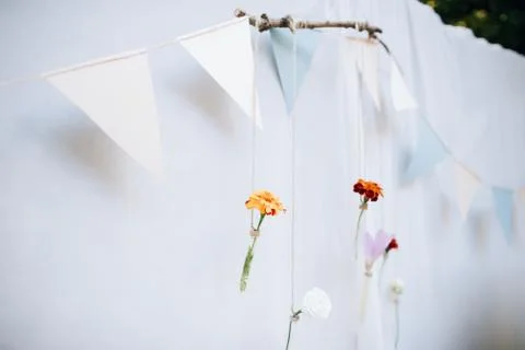 Beautiful wedding hand made rustic decorations of glass bottles and flowers. Stock Photos