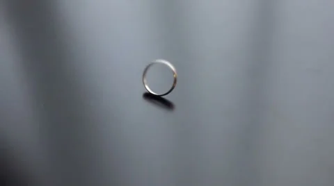 Beautiful wedding ring rotates on dark background Stock Footage 55664677