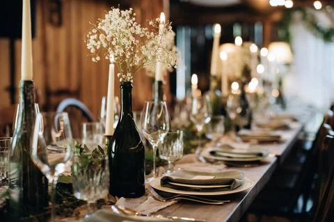 Beautiful wedding table decor in a rustic style. Decor ideas with candles and Stock Photos