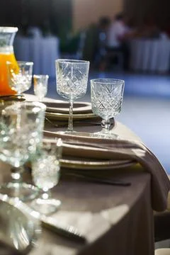 Beautiful wedding table setting with crystal glasses Stock Photos