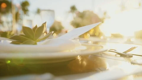 Beautiful wedding table with white plate and cultery in sunshines ,resort hyatt Stock Footage 101117706