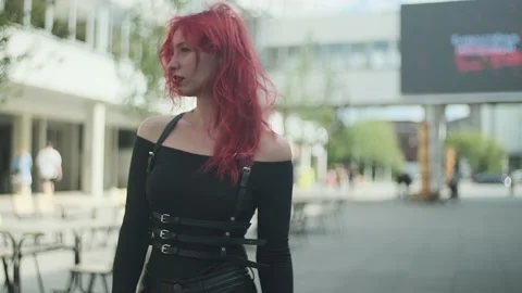Beautiful well dressed red-haired girl with ring in her nose on the street Stock Footage 161036946
