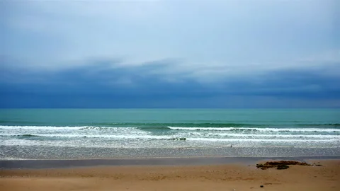 Beautiful while turquoise sea waves break on the sandy coastline. Stock Footage 240694759