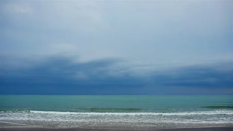 Beautiful while turquoise sea waves break on the sandy coastline Stock Footage 240782386