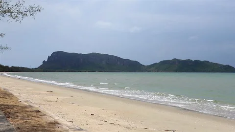 Beautiful while turquoise sea waves break on the sandy coastline Stock Footage 242739432