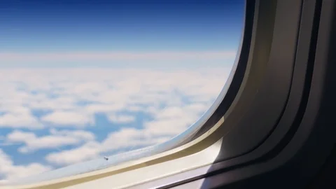 Beautiful white and blue cloudscape out of focus view from airplane window Stock Footage 92442025
