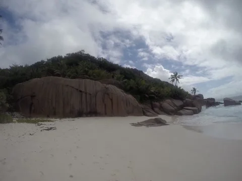 Beautiful white beach on a cloudy day. Seychelles, Praslin. Stock Footage 131337024