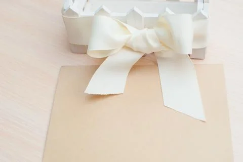 Beautiful white bow kraft paper and space for text 写真素材