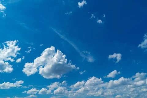 Beautiful white clouds on a background of blue sky Stock Photos
