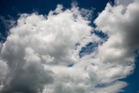 Beautiful white clouds on a blue cloudy sunny sky Stock-Fotos