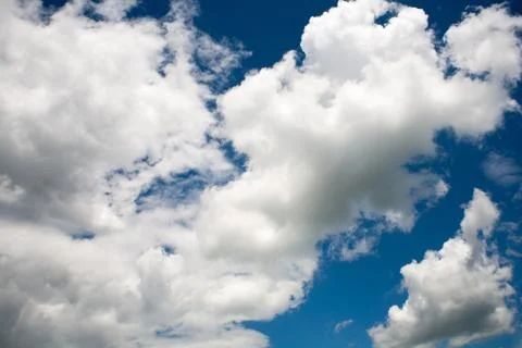 Beautiful white clouds on a blue cloudy sunny sky Stock Photos