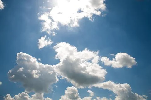 Beautiful white clouds on a blue cloudy sunny sky Stock Photos