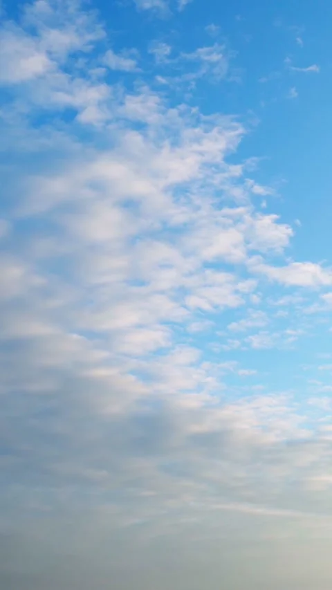 Beautiful white clouds in a blue sky. Vertical video, shorts. Stock Footage 274355085
