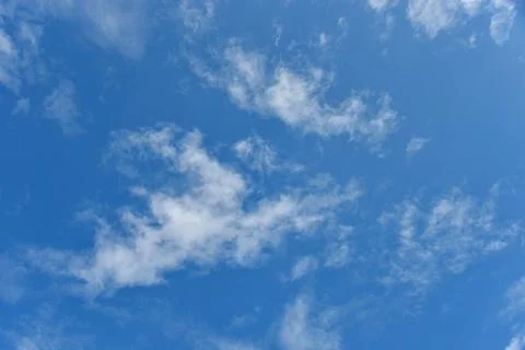 Beautiful white clouds on blue sky background. Stock Photos