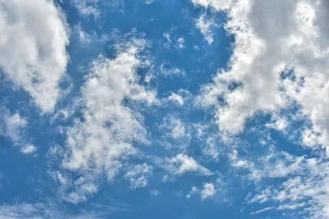 Beautiful white clouds on blue sky background. Stock Photos