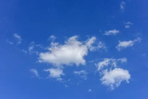 Beautiful white clouds on blue sky background. Stock Photos