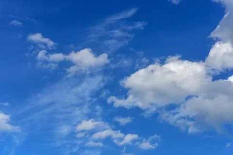Beautiful white clouds on blue sky background. Stock Photos