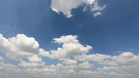 Beautiful white clouds floating in the blue sky with sunlight rays Stock Footage 205779161