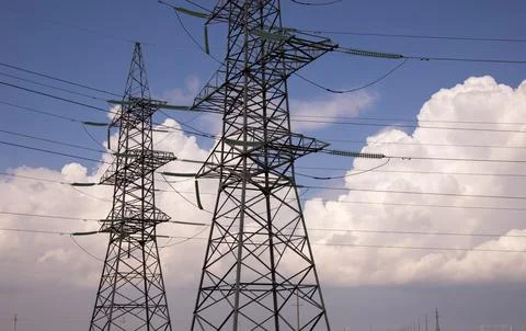 Beautiful white clouds with high voltage towers. Stock Photos