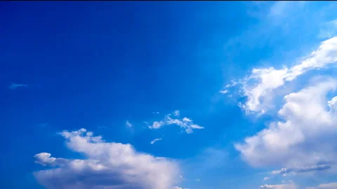 Beautiful white clouds move across the blue sky. Time Laps composition in motion 스톡 동영상 136776673