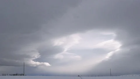 Beautiful white clouds over snowy landscape Stock Footage 83864752