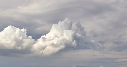 Beautiful white clouds passing below blue sky in timel apse clip Stock Footage 131433212
