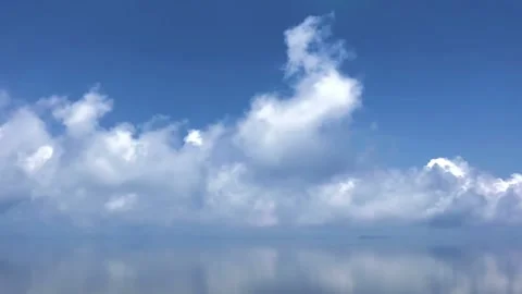 Beautiful white clouds in time lapse over a blue background Stock Footage 94859841