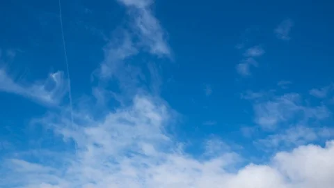 Beautiful white clouds time lapse against deep blue sky in summer. Stock Footage 104412063