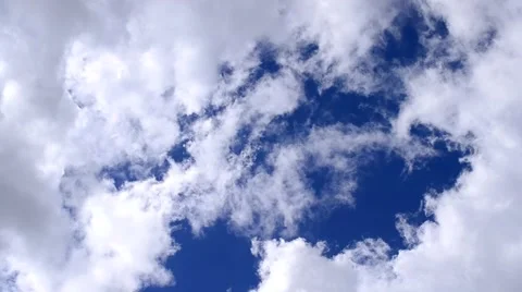 Beautiful white cumulus clouds moving in blue sky Stock Footage 62755504
