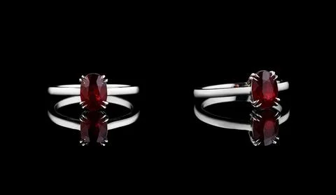 Beautiful white gold ring with a ruby on a black background 스톡 사진