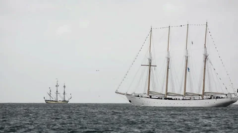 Beautiful white sailing ship with smaller ship on the background Stock Footage 30440070