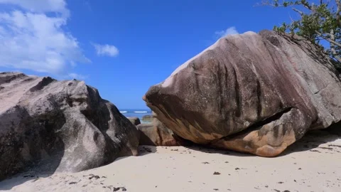 Beautiful white sandy beach and huge granite stones, Baie Lazare beach Stock Footage 330854873