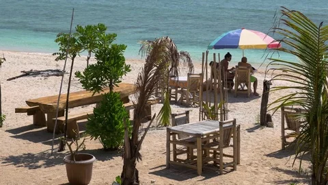 Beautiful white sandy beach clear blue sea paradise island palm trees Gili Me Stock Footage 83693482