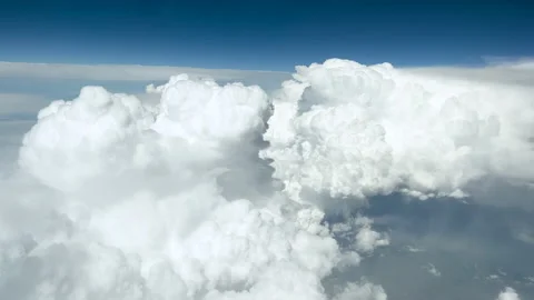 Beautiful white soft fluffy clouds and clear sunny blue sky from flying plane Video stock 171405832