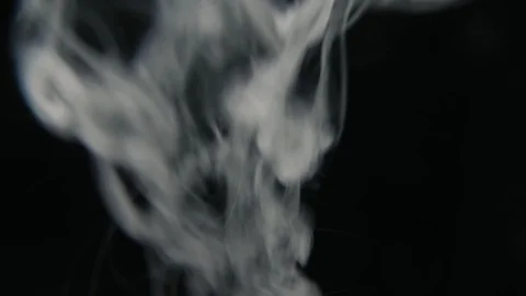 Beautiful white steam from e-cigarette on black background. Smoke of vape device Video stock 103112172