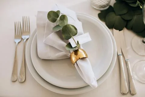 Beautiful white table setting for wedding celebration in restaurant Stock Photos