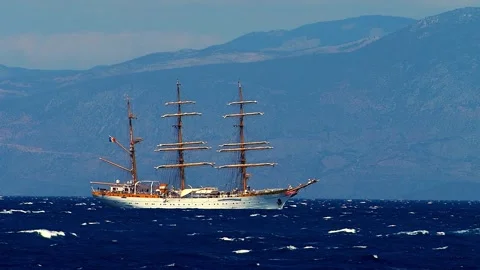 A beautiful white three masted sailing ship rides the blue sea. Stock Footage 314424497