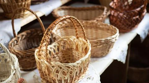 Beautiful wicker baskets on the table. Brown textured picnic and food carrying Photos
