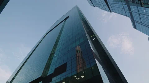 Beautiful wide angle view from below from a moving camera on tall skyscrapers Stock Footage 168427474