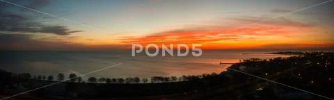 Beautiful wide panorama landscape photograph of a vivid sunrise Stock Photos