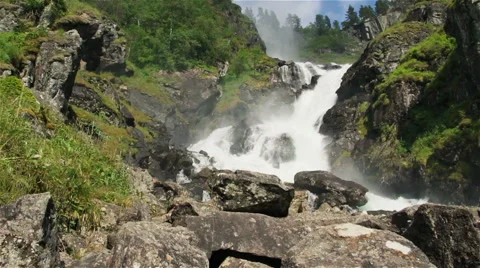 Beautiful wild waterfall in the mountains Stock Footage 52999711