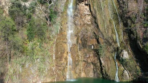 A beautiful wild waterfall Uchan-Su in a forest thicket  Stock Footage 233606556