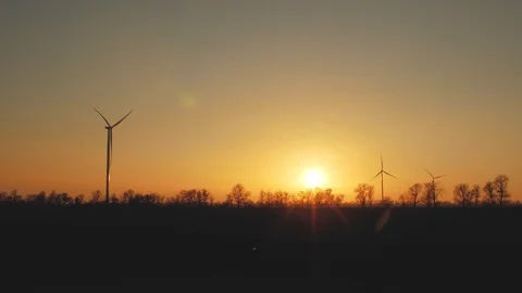 Beautiful wind turbines using clean wind energy at sunset. green energy Stock Footage 103497199