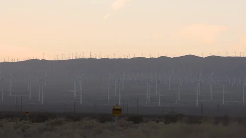 Beautiful windmill farm during sunset Stock-Footage 99076986