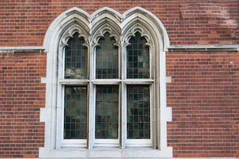 Beautiful window in gothic style. Three arches. London city Stock Photos