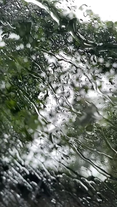 Beautiful window with rain falling on it. Stock Footage 299256028